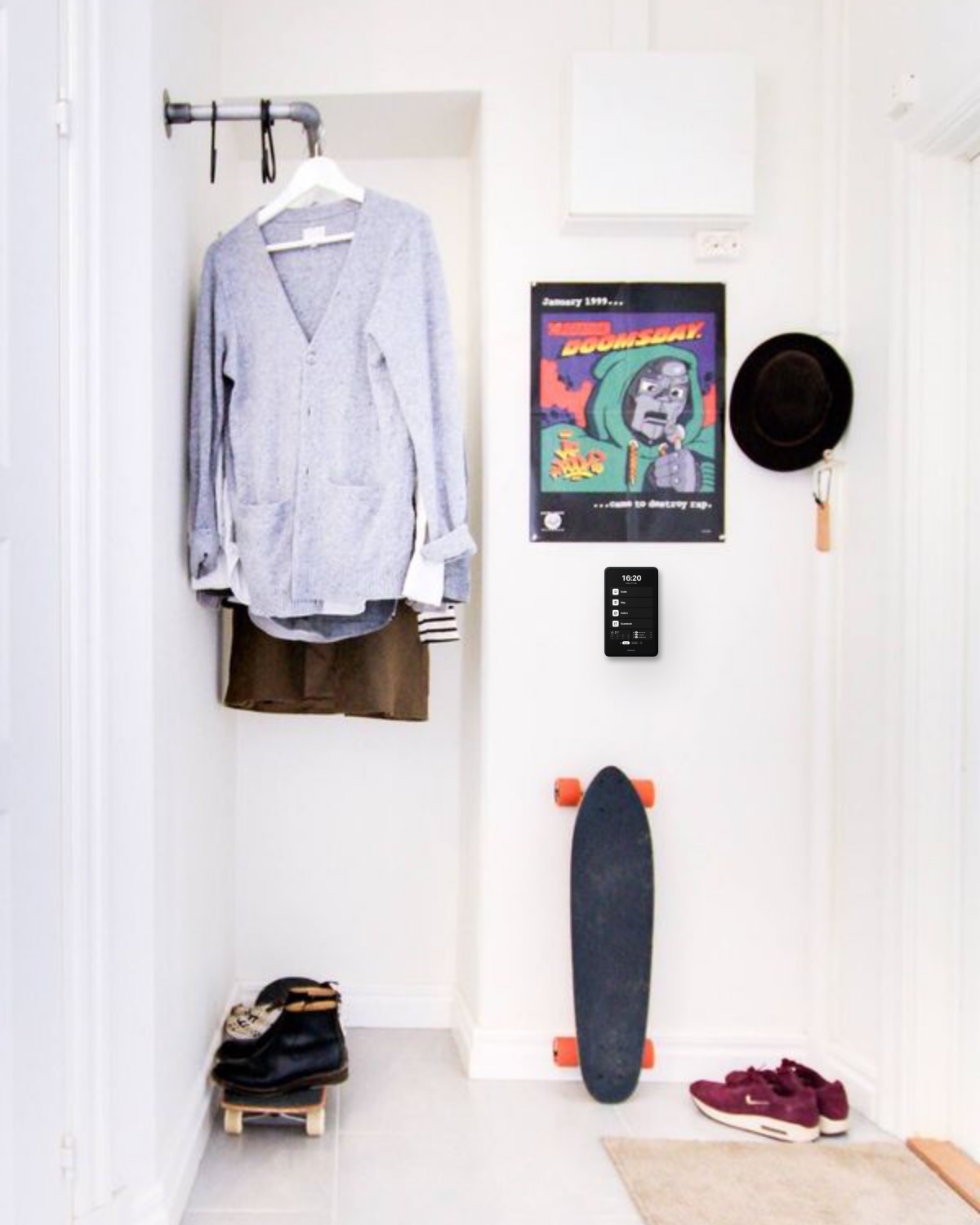 RentalOS kiosk mounted in the hallway next to a poster and a longboard