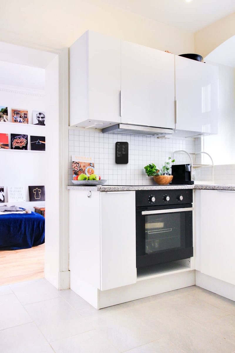RentalOS kiosk on the kitchen tiles showing the house guide