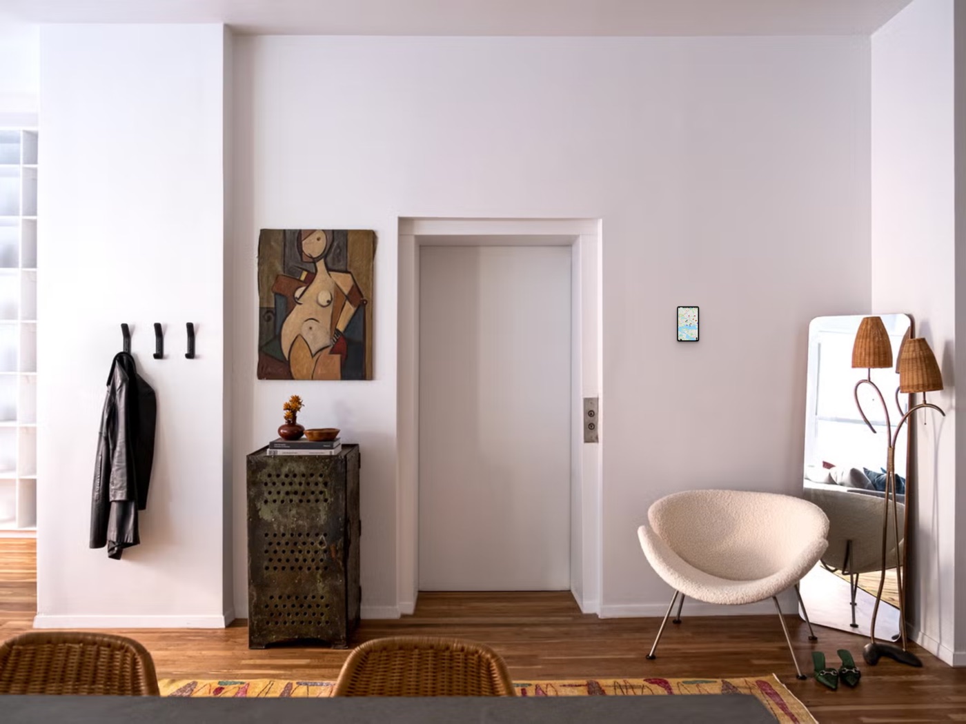RentalOS kiosk showing the map, mounted in an art-filled loft next to the elevator door